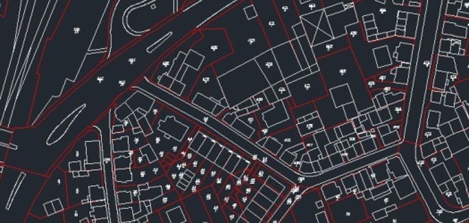 Schwarz-weiße Linienzeichnung eines Stadtplans mit Straßen und Gebäuden